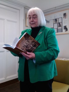 Joan reading from Duty