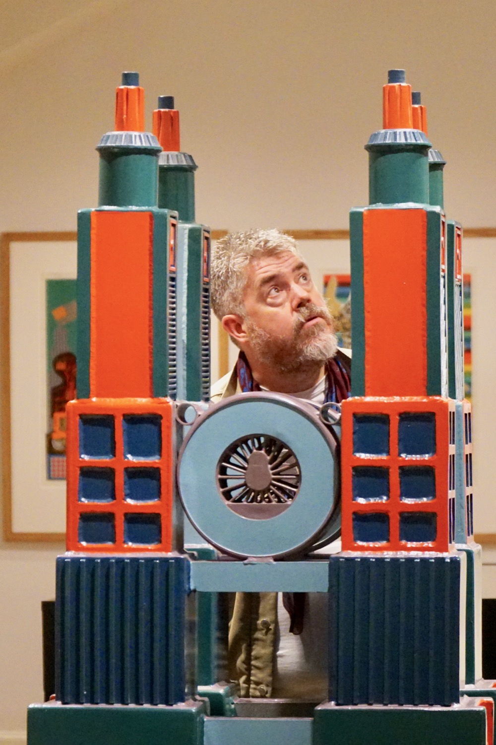 Phill Jupitus looks up next to the Paolozzi sculpture
