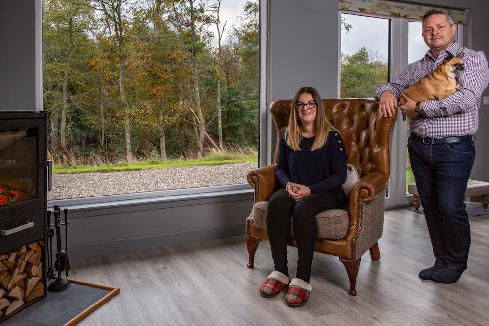 Alex and Daniela in their holiday home with their pet dog