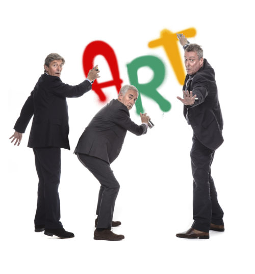 Three actors pose with the word ART