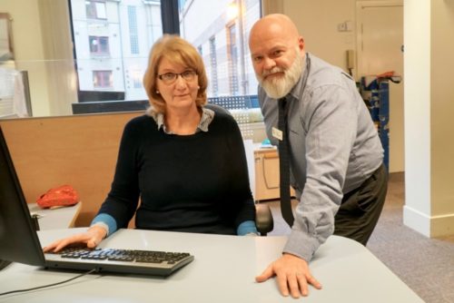 Two DWP representatives in their office