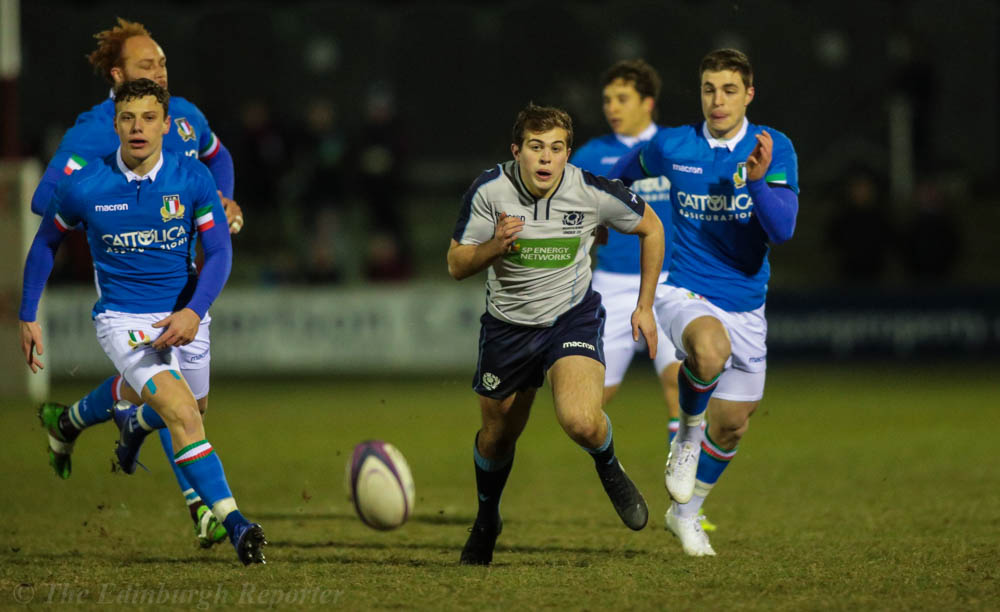 Scotland player chasing the ball